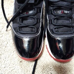 Jordan 11s Bred , size 9, black and red